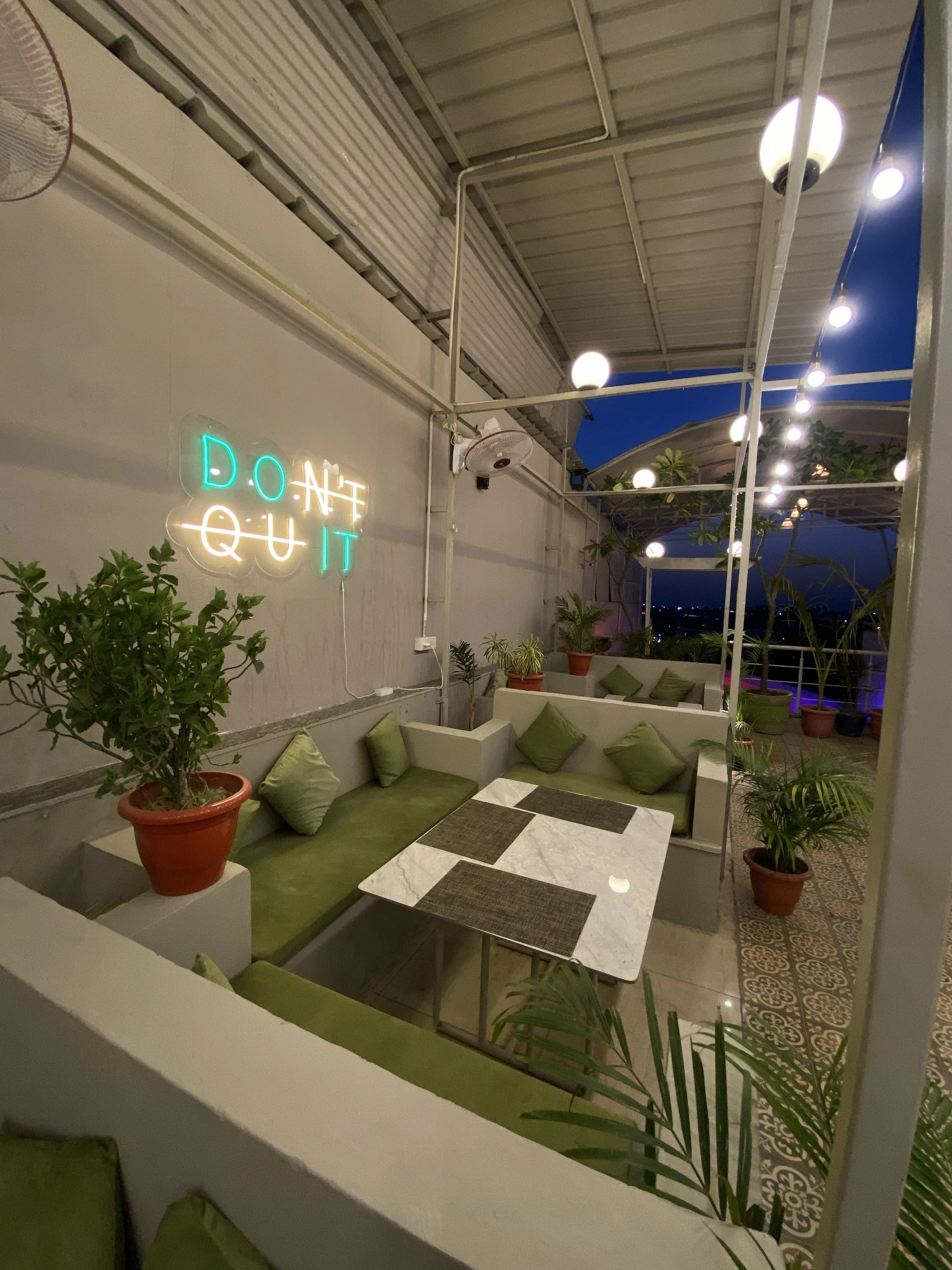Club Clyrova rooftop lounge corner and do not quit neon decor