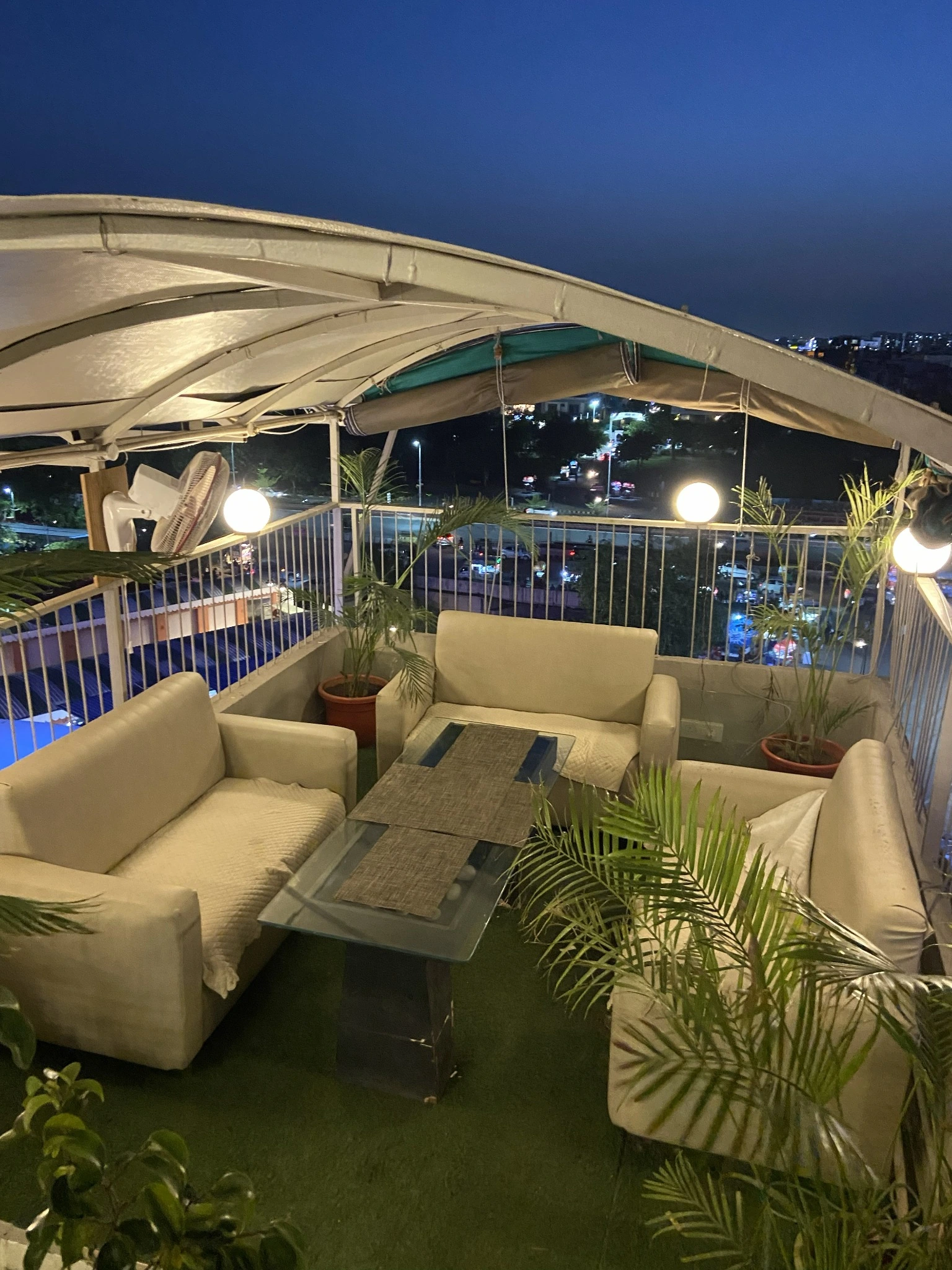 Club Clyrova upper rooftop sofa seating with city view